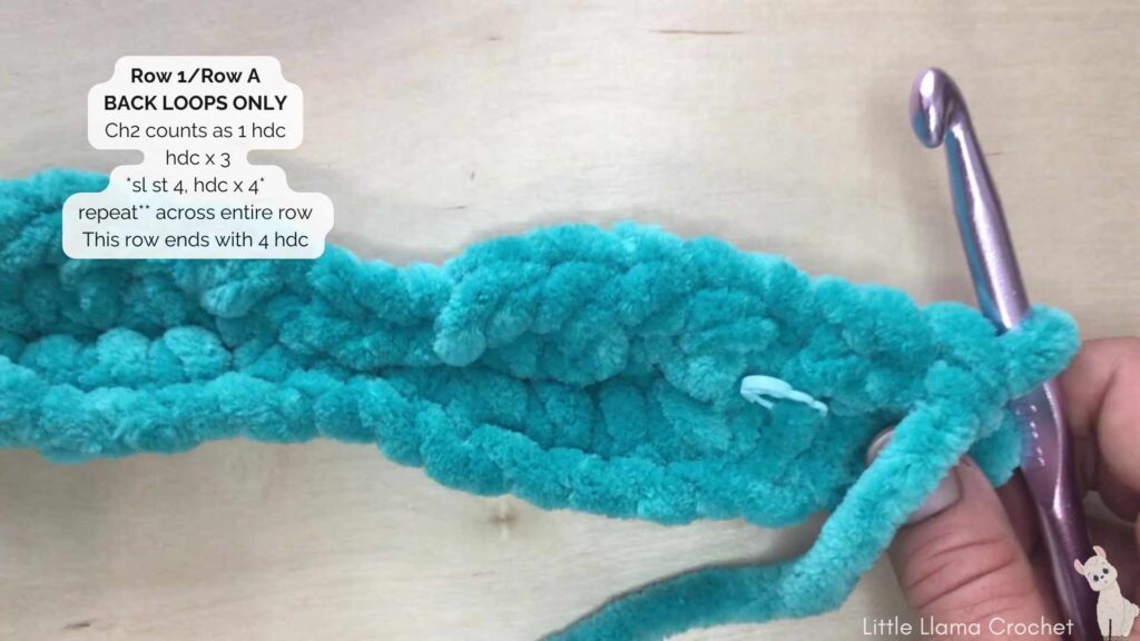 Row 1 Crochet Tutorial action shot with a 10 mm crochet hook and blue plush chunky chenille yarn